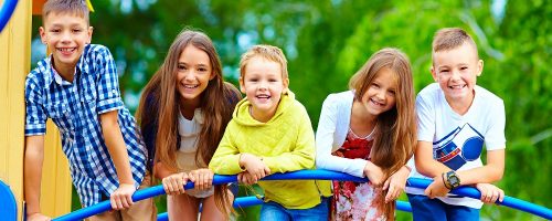 smiling excited kids having fun together on playground